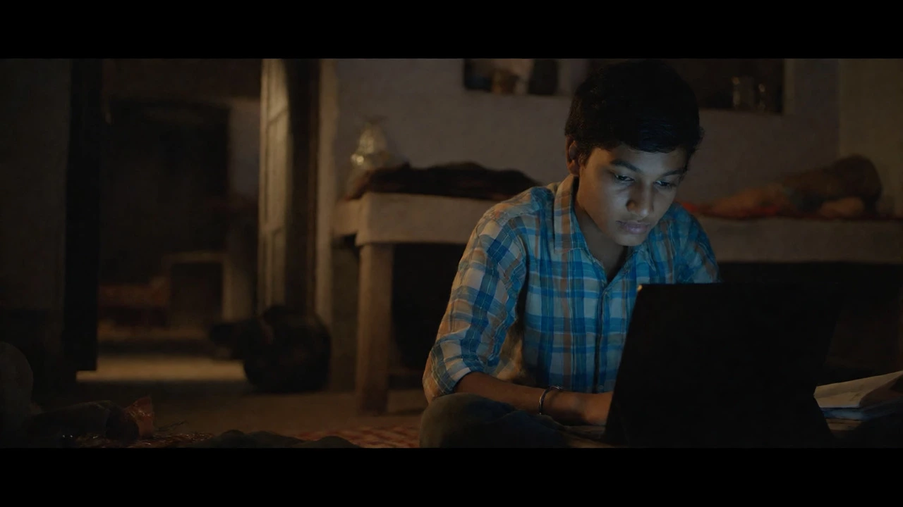 Student studying at home via tablet, showing access to online NEET coaching resources.